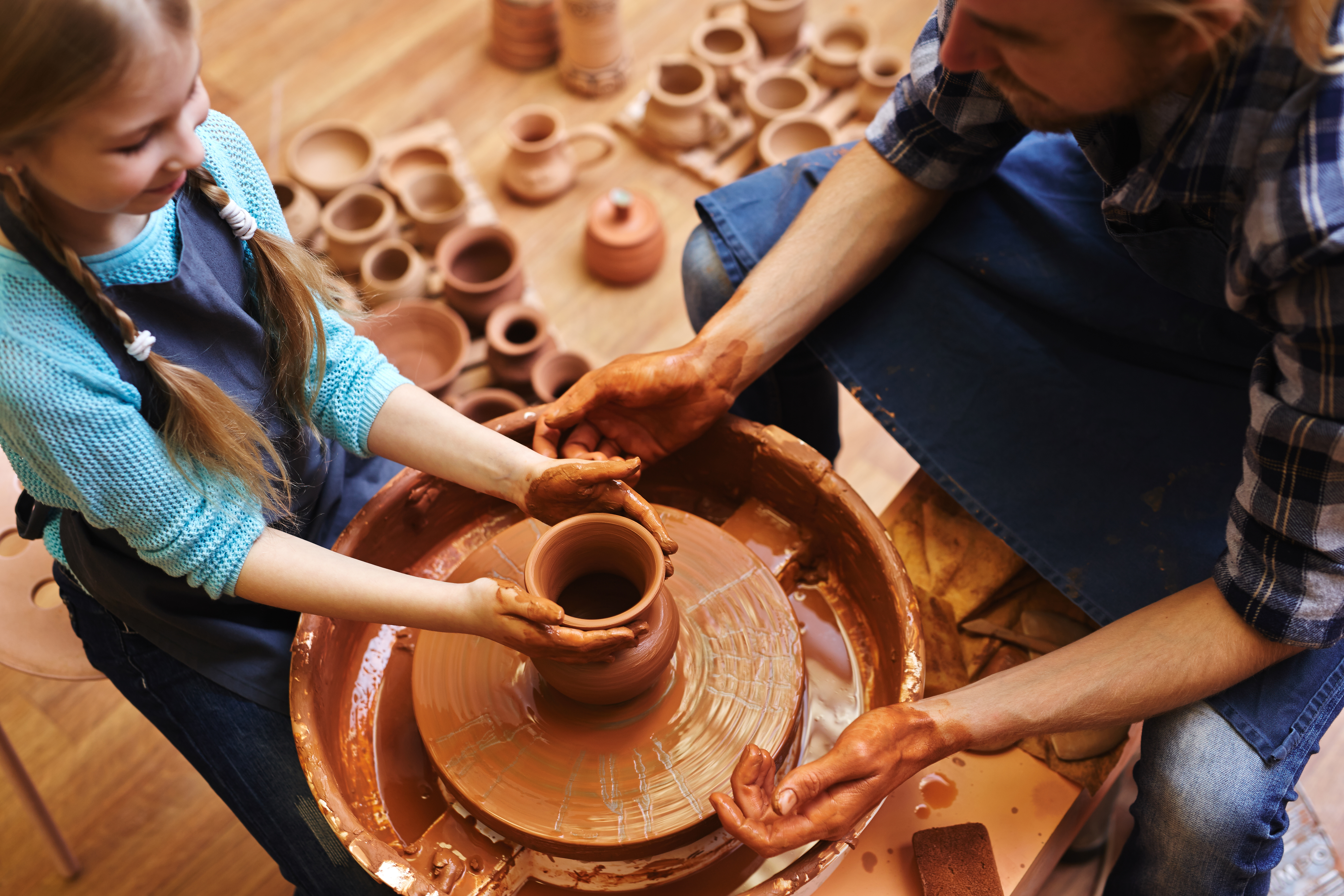 image of a girl doing pottery