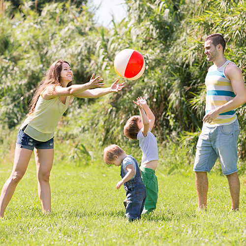 a family playing with a ball